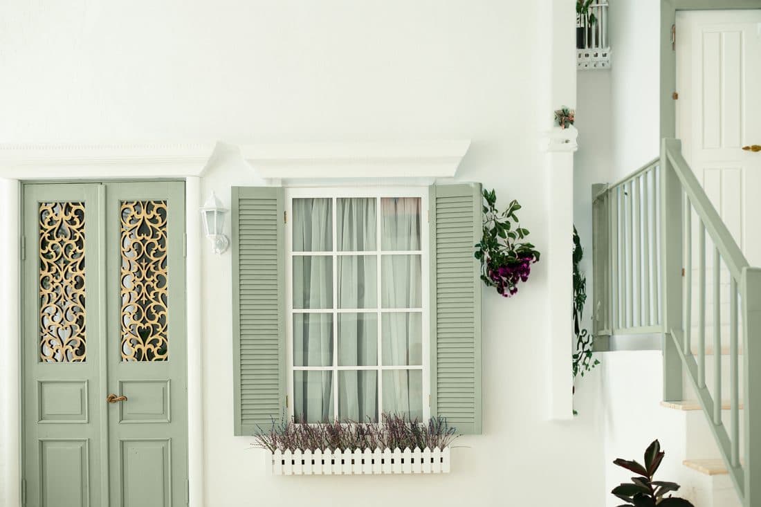 On-trend sage green woodwork in a bright interior