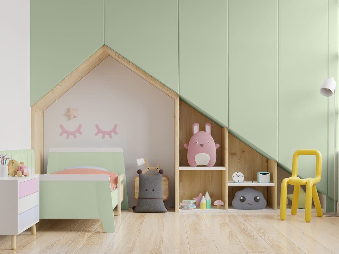 Sage green painted furniture in a styled room